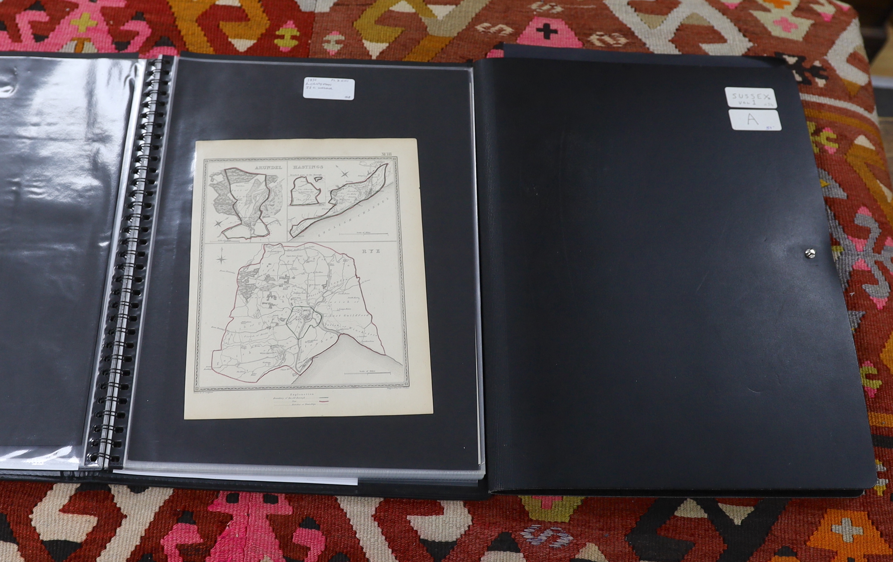 Two folders containing eighty-one mainly 18th and 19th century maps and charts, etc. relating to Sussex and it’s environs, including; engravings from books, some in mounts, town plan of Brighton, distance charts, etc.